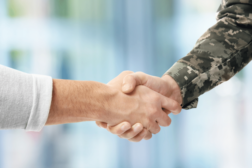 military member shaking hands with agent