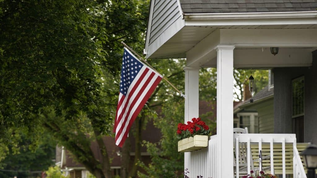 US Flag mounted on front porch of home